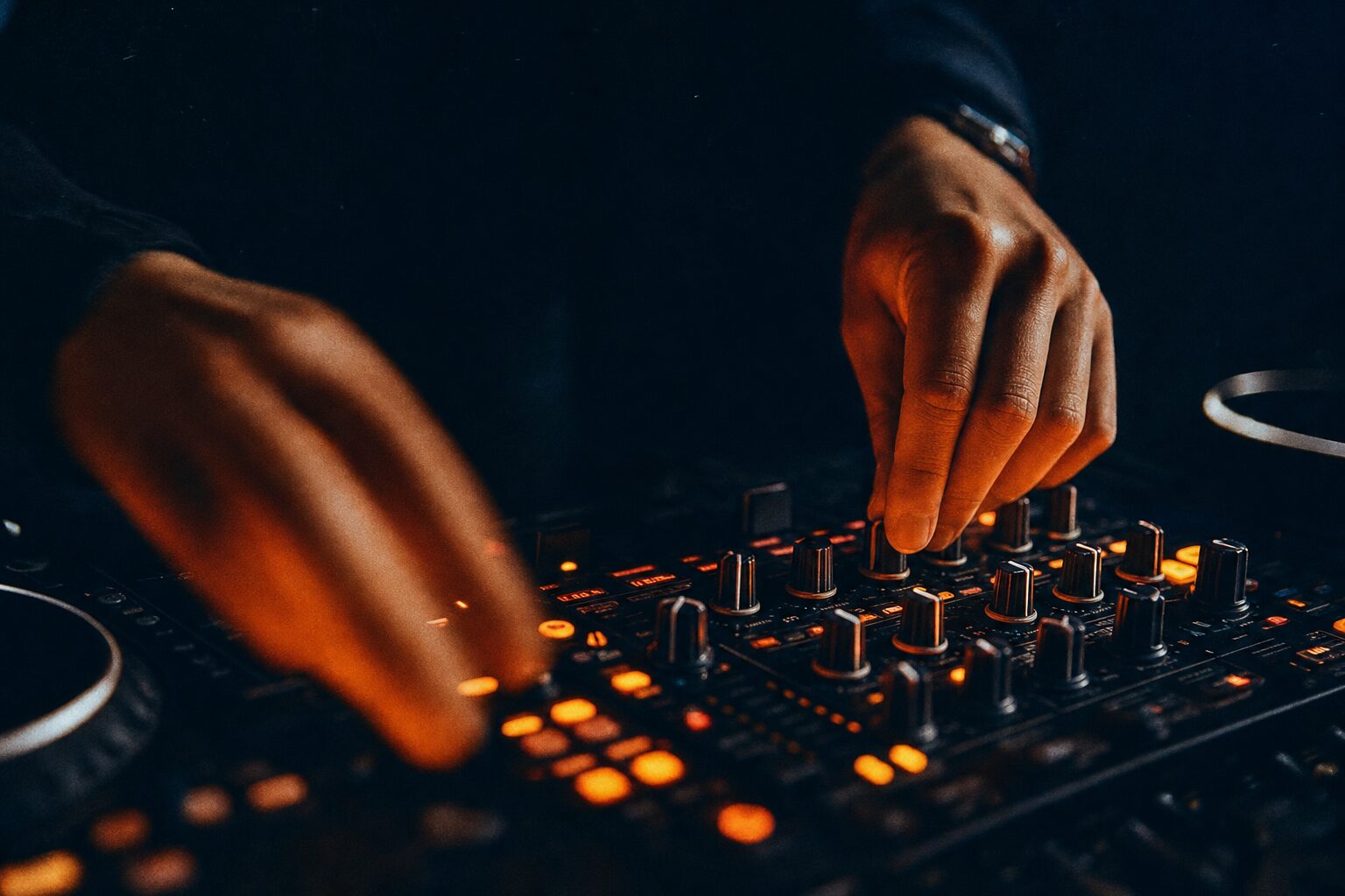 Close-up of DJ mixer hands